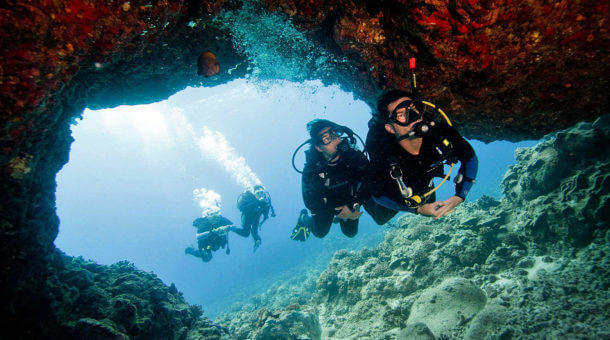 Divers Heading Through a Swimthrough