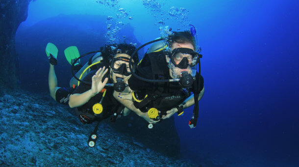 Scuba Divers Underwater in Thailand
